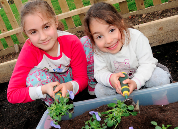 Green fingers: some young gardeners pitched in to help this year's Islington in Bloom competition to flower, at the launch event. Photographs: Islington Council